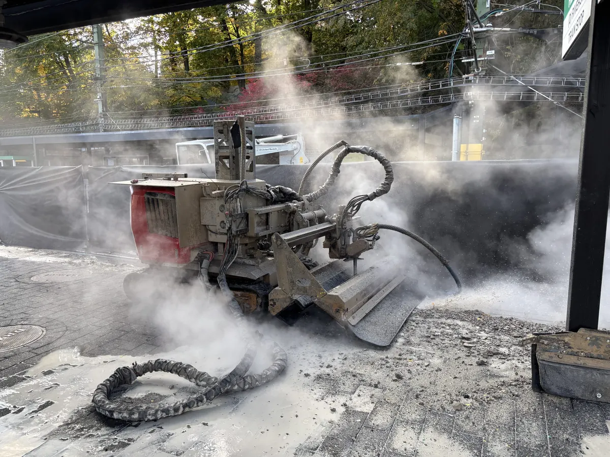 Hydro-demolition robot cutting concrete with a water jet